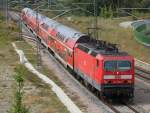 143 210-3 mit S1 von Rostock Hbf nach Warnemnde bei der Einfahrt in Warnemnde Werft.10.08.2013