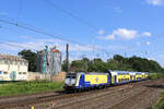 146 03 verl�sst den Tostedter Bahnhof am 16.07.2026 und macht sich auf den Weg nach Hamburg. Im Hintergrund sind die Abrissarbeiten der Lagerhallen u. der Siloanlagen zu sehen.