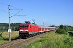 Mit einem Kreuzfahrerzug nach Berlin rauscht 114 005 am Kilometer 107,8 (nahe Kavelstorf)gegen 08:50 vorbei.  