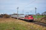 Mit dem IC 2409 nach Hamburg rollt die 115 448 am 15.01.2012 durch Sildemow in Richtung Schwerin.