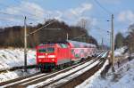 Mchtige Wolken trmen sich am 22.03.2013 ber der 120 203 auf.Kurz nachdem sie mit dem RE 4306 (Rostock-Schwerin-Hamburg) durch Sildemow sauste begann es auch wieder zu schneien..nix neues im Mrz