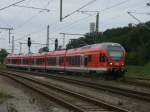 RE 13011 Rostock-Sassnitz,gefahren von 429 030,am 21.September 2011,bei der Ausfahrt aus Lietzow.