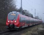 442 841-3+442 353-9(schadhaft)als berfhrung von Rostock-Marienehe nach Rostock Hbf bei der Durchfahrt im Bahnhof Rostock-Bramow.06.12.2014 