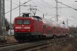 112 190 mit RE 4356  von Lutherstadt Wittenberg  nach Rostock Hbf bei der Einfahrt im Rostocker Hbf.01.03.2012