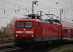 112 114 mit RE1(WR-AH)bei der Ausfahrt am 22.11.2014 gegen 09:09 Uhr im Rostocker Hbf.