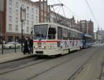 Tatra-Straenbahn vom Typ T6A2 mit Bildern von Zeitungsausschnitten ber den Mauerfall fhrt als Linie 1 von Haffenallee,Rostock Richtung Rgener Str, Rostock Aufgenommen am 10.03.10 in der