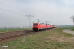 185 218-5 + 145 014 mit einem Containerzug bei Borsdorf bei Leipzig.