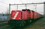 Am 24 Februar 2004 steht NS Cargo 6518 in Tilburg mit der Opel-Ganzzug Rüdesheim--Antwerpen-Oorderen.