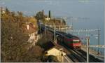 Die SBB Re 460 003-3 mit einem IR bei St-Saphorin.