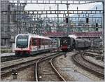 Die 141 R 1244 des  Vereins Mikado 1244  begegnet in Luzern deinm Zentralbahn  Flink  ABeh 161 013 auf dem Weg nach Engelberg.