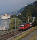 SBB Re 460 005-6 mit einem IR nach Birg beim Château de Chillon.