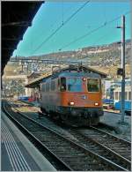 Die im Interregio-Cargo Farbkleid gehaltene Re 4/4 II 11320 in Vevey, links im Bild ein B-C Neuzugang.