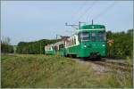 Der BAM Regionalzug 110 mit dem Bt 52 an der Spitze und dem schiebenden Be 4/4 N° 12 zwischen Chigny und Vufflens-le-Château.