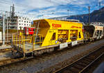 Vierachsiger Schmalspur Drehgestell-Schotterwagen RhB Xac-t 93804 (Dienstwagen) eingereiht in einen Bauzug am 01.11.2019 im Rbf Chur (aufgenommen aus einem Zug heraus).