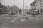 SZB Pendelzug mit Triebwagen 21 und die ehemalige Tramlinie 1 mit dem Zug 173-228 am einstigen Bahnhofplatz vor dem Hotel Schweizerhof.