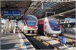 Lausanne mit zwei Zügen nach Frankreich: Der SBB RABe 511 030 ist als RE 33 auf der Fahrt nach Annemasse und der TGV Lyria nach Paris.