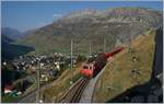 Die MGB HGe 4/4 II 108 ist mit ihrem Regionalzug 819 von Disentis kommend schon bald am Ziel ihrer Fahrt nach Andermatt, welches bereits zu erkennen ist.