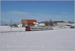 Ein TPF RABe 527  Flirt  auf dem Weg nach Bulle konnte zwischen Sâles und Vaulruz in dieser herrlichen Winterlandschaft fotografiert werden, wobei im Hintergrund bereits Wolken einer Warmfront